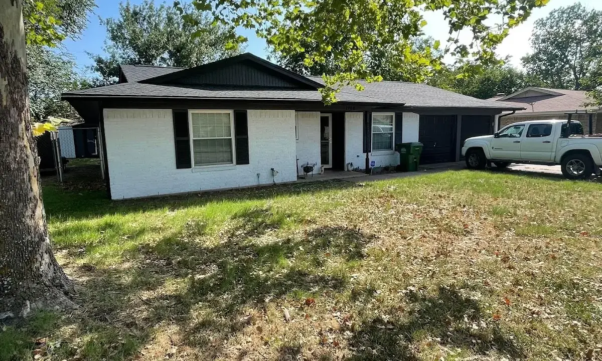 Professional roofing crew working on a residential roof in La Grange